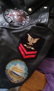 Adding Ralph's Navy crow to his motorcycle jacket.